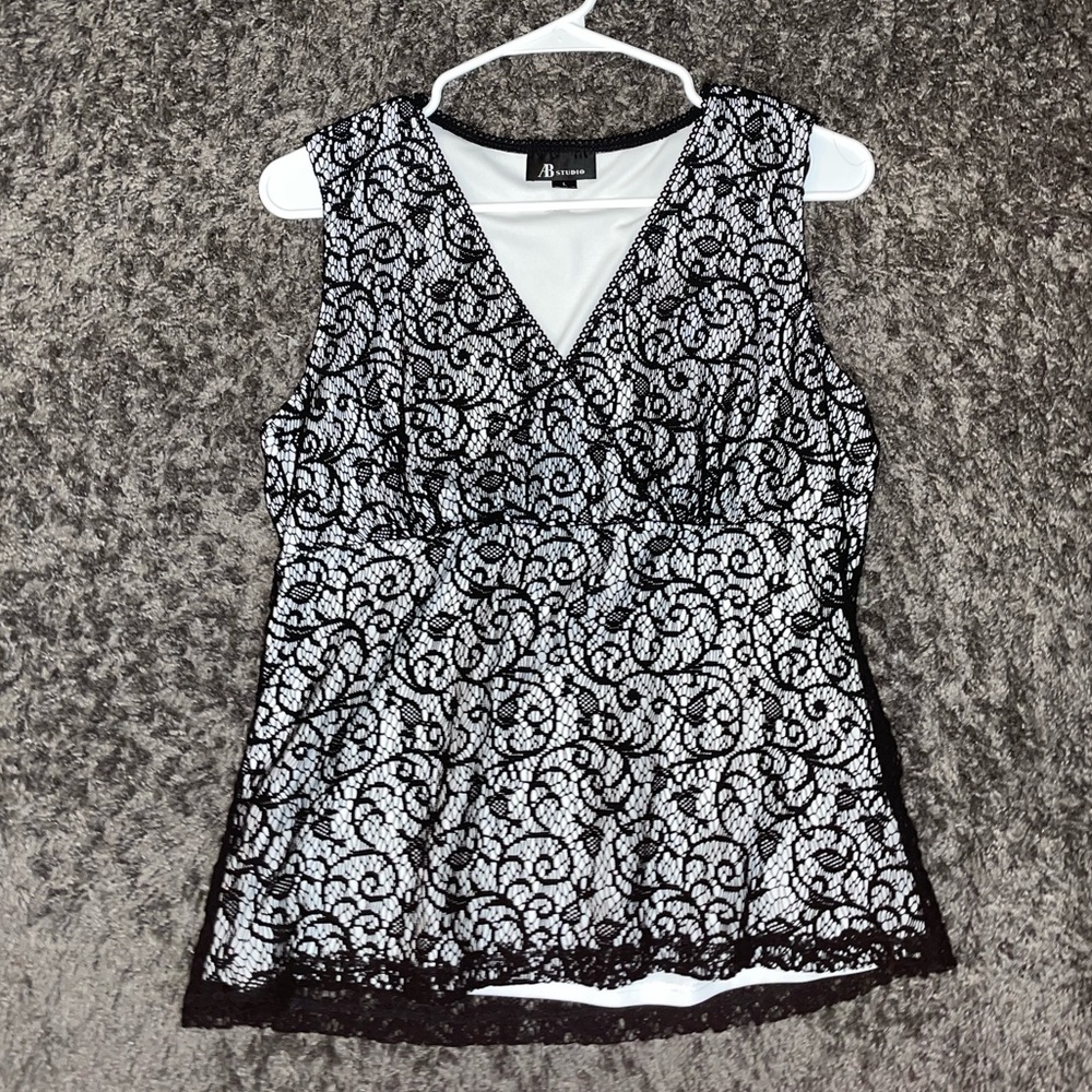 A large Black and white lace-up top with a V-neck from AB studio #goth #grunge